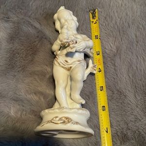 Porcelain Vintage cherub with bird and wood in hands with gold trimming #7223
